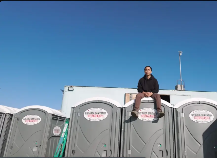 Man sitting on Potty cabins