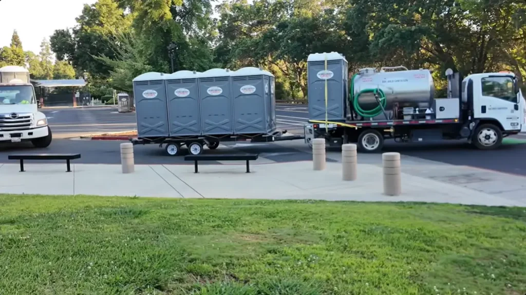 porta potty cabins are being transported