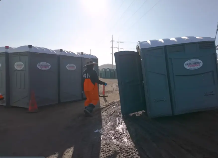 man going to use potty cabin